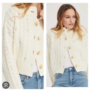 SomethingNavy cream sweater with floral embellishments.
